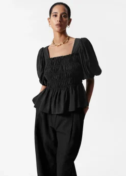 & Other Stories Gesmokte Bluse mit Puffärmeln